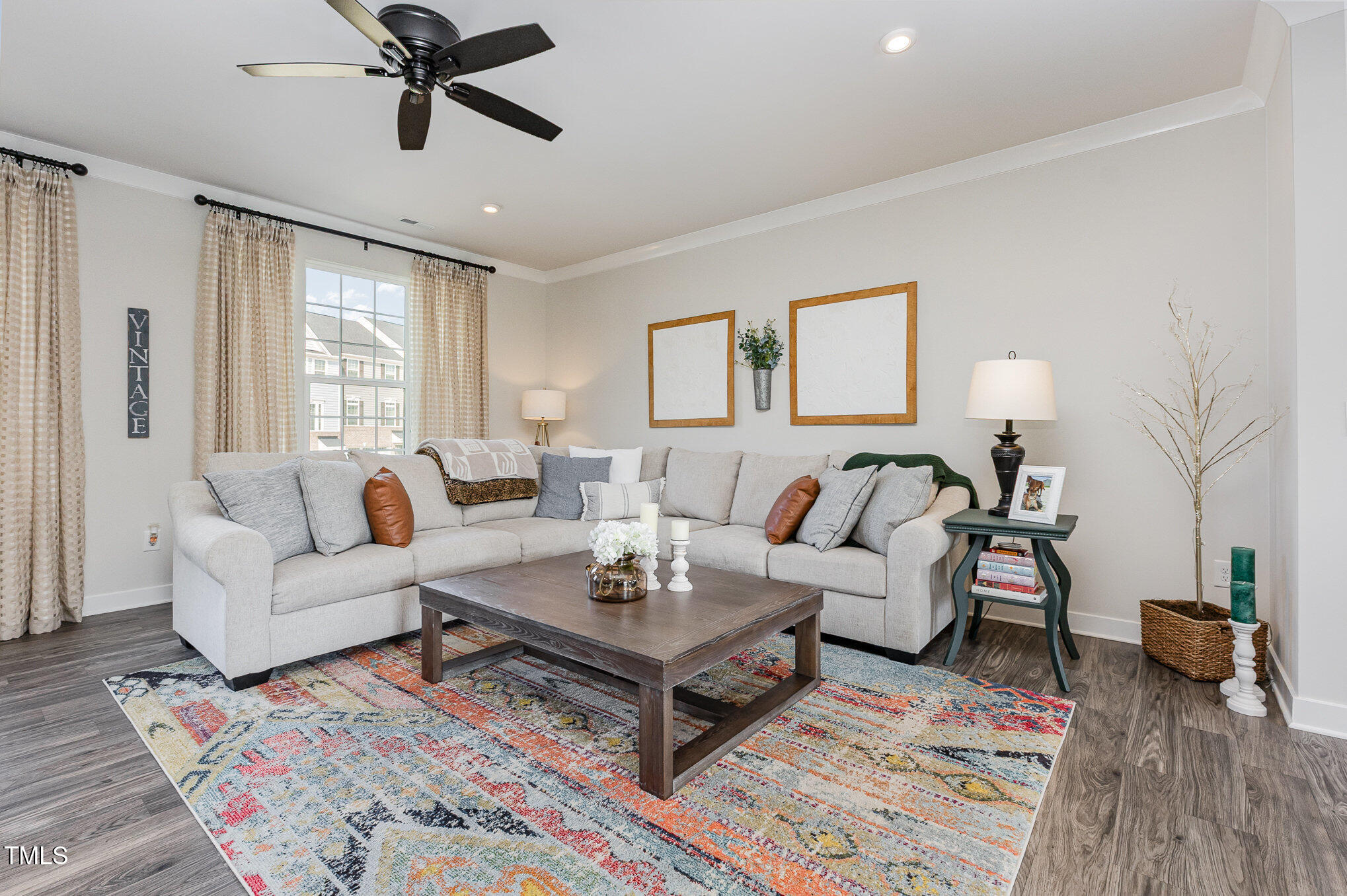 235 Misty Pike Drive Raleigh, NC 27603 - Photo 7 of 29 a living room with furniture and a wooden floor