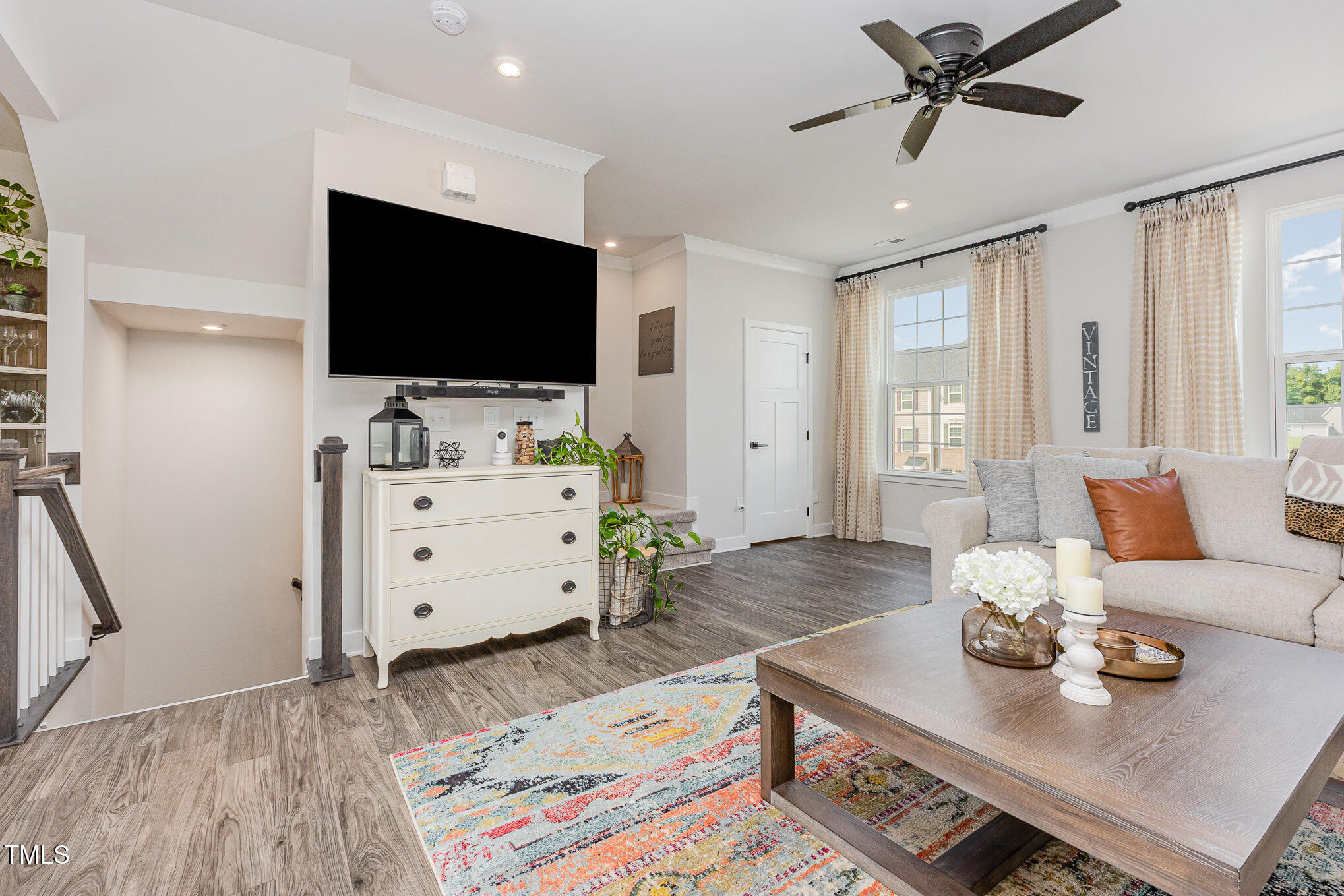 235 Misty Pike Drive Raleigh, NC 27603 - Photo 8 of 29 a living room with furniture and a flat screen tv