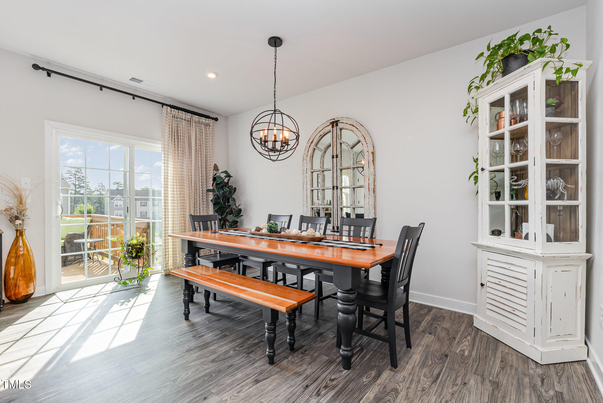 235 Misty Pike Drive Raleigh, NC 27603 - Photo 9 of 29 a view of a dining room with furniture window and wooden floor