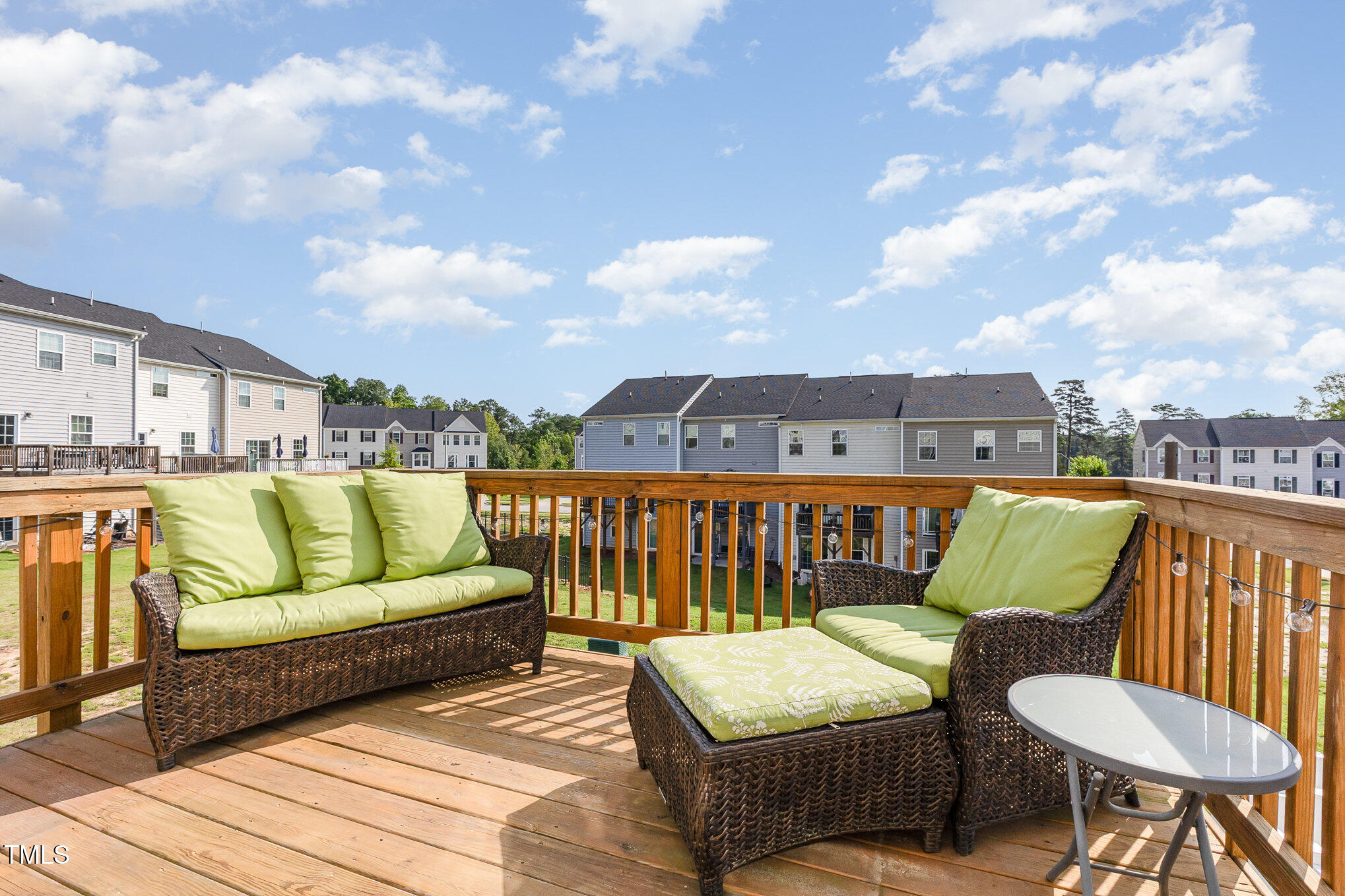 235 Misty Pike Drive Raleigh, NC 27603 - Photo 10 of 29 a roof deck with couches and wooden floor
