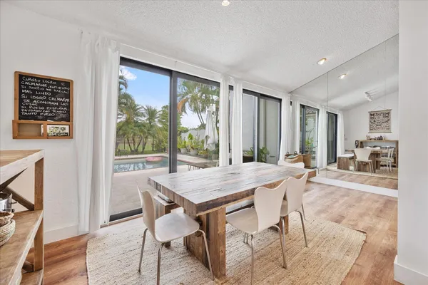 a view of a dining room with furniture window and outside view