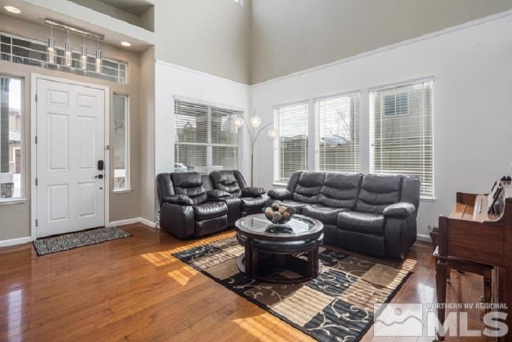 10575 Kenai Drive Reno, NV 89521 - Photo 4 of 40 a living room with furniture a window and a table