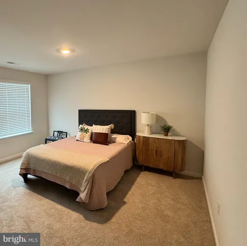 a view of a big room with furniture and a flat screen tv