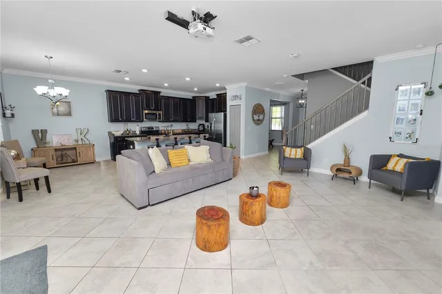 a view of a dining room with furniture and window