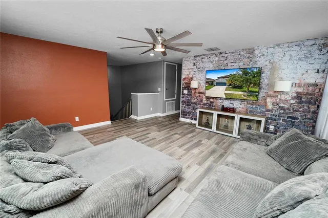 a view of patio with a table and chairs under an umbrella