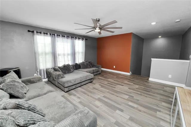 a view of a hallway with two potted plant and a potted plant