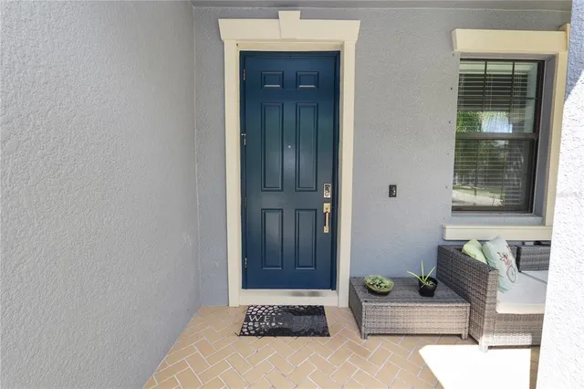 a kitchen with a stove a sink a microwave a dining table and chairs