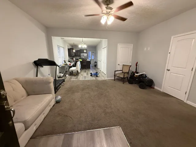 a kitchen with a sink and refrigerator