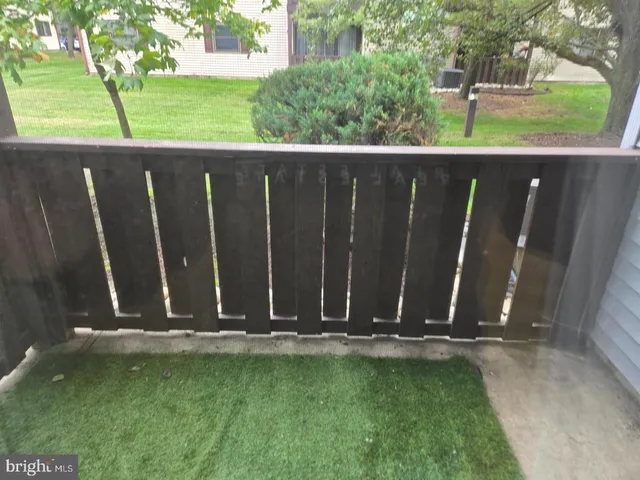 a view of outdoor space with a wooden fence