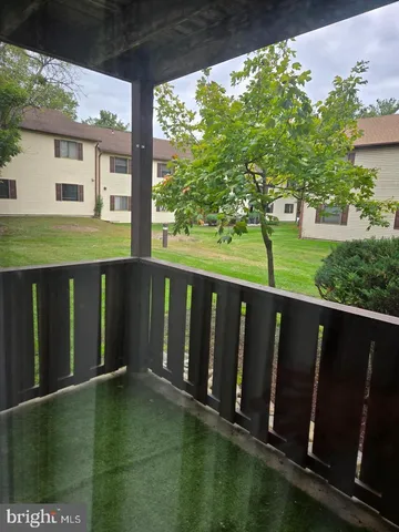 a balcony with wooden floor