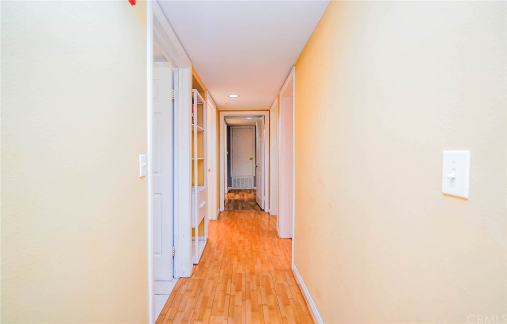 116 West Maple Street, Unit 6 Glendale, CA 91204 - Photo 20 of 61 End of hallway is master bedroom & bathroom / to the right is the two bedrooms / to the left is the laundry room and then the bathroom