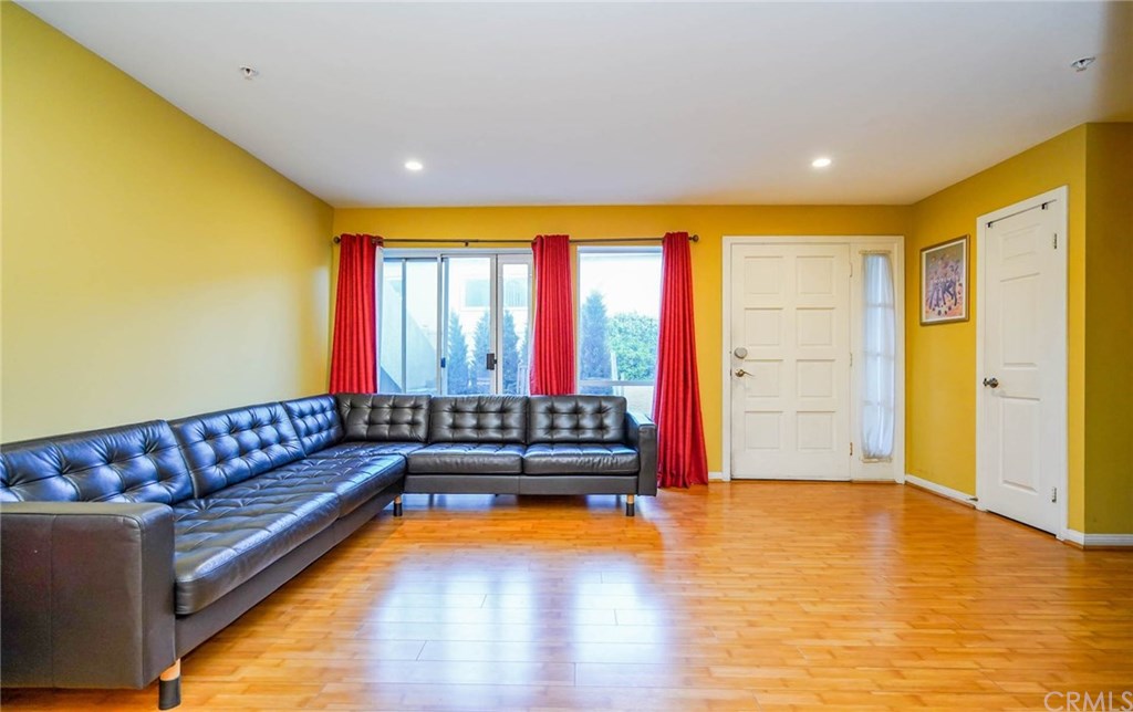 116 West Maple Street, Unit 6 Glendale, CA 91204 - Photo 8 of 61 Family Room - looking at the front door and the sliding door leading to the private patio
