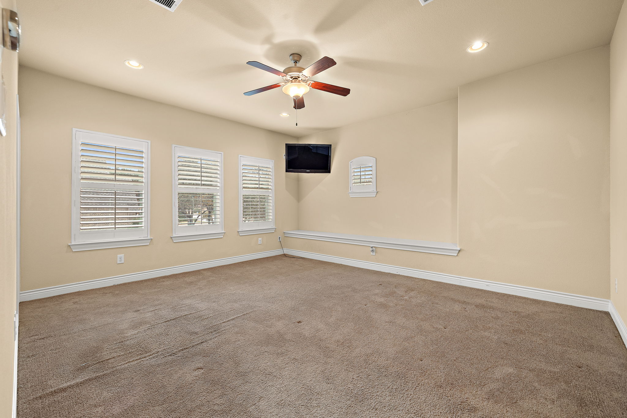 174 Estrella Crossing Georgetown, TX 78628 - Photo 27 of 38 Empty room featuring carpet floors, recessed lighting, and ceiling fan
