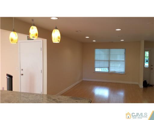 33 Woodbury Road Edison, NJ 08820 - Photo 11 of 11 a black and white photo of a living room