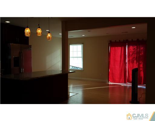33 Woodbury Road Edison, NJ 08820 - Photo 4 of 11 a black and white photo of a living room