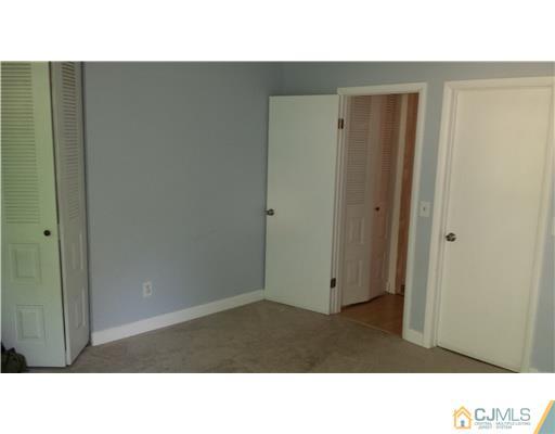 33 Woodbury Road Edison, NJ 08820 - Photo 6 of 11 a black and white photo of a room