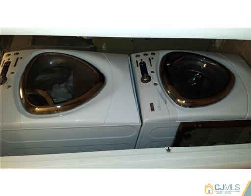 33 Woodbury Road Edison, NJ 08820 - Photo 9 of 11 a kitchen with a sink and a washer