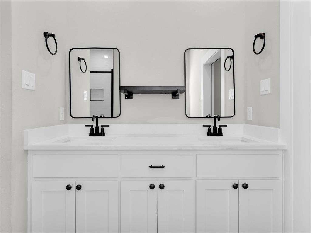 4905 Sweetbay Road Sherman, TX 75092 - Photo 17 of 26 a bathroom with a sink and mirror