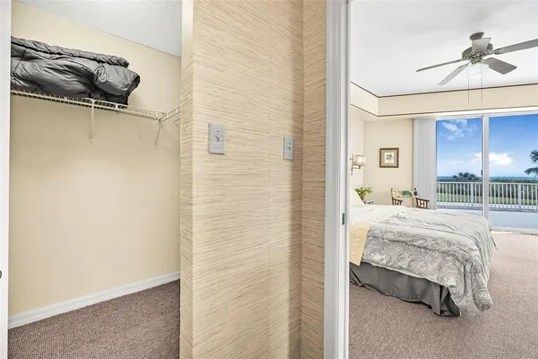 a living room with furniture and a clock