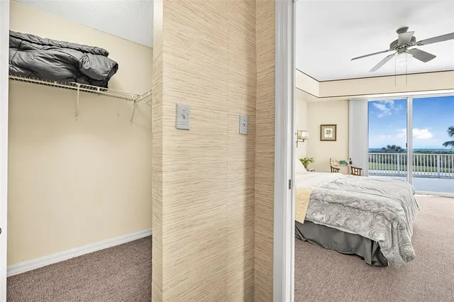 a living room with furniture and a clock