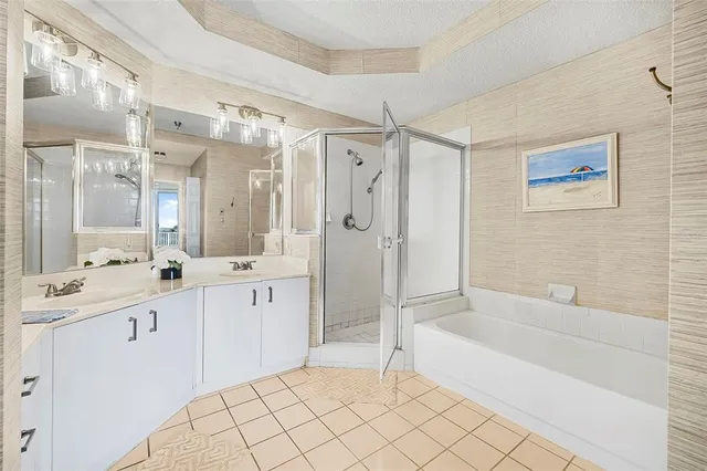 a bathroom with a bathtub and a shower