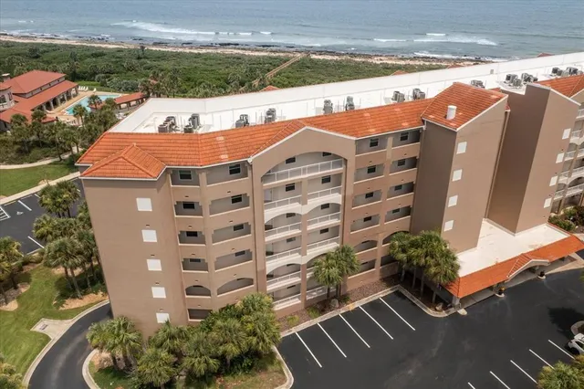 a view of a swimming pool with a yard