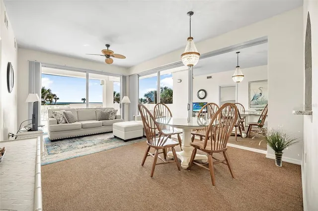 a view of a chairs and table in patio
