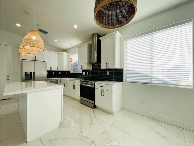 a kitchen with stainless steel appliances cabinets a sink and a counter top space