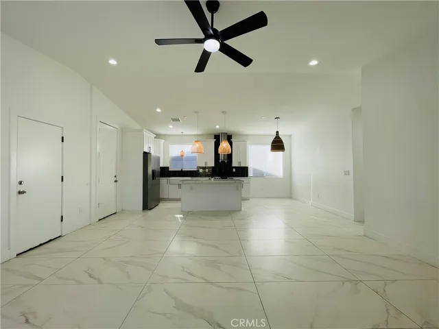 a view of a kitchen with a sink and a window