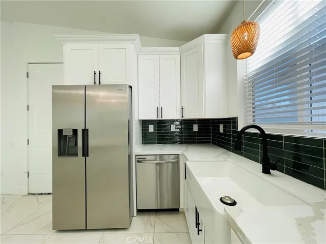 a kitchen with a sink and a stove