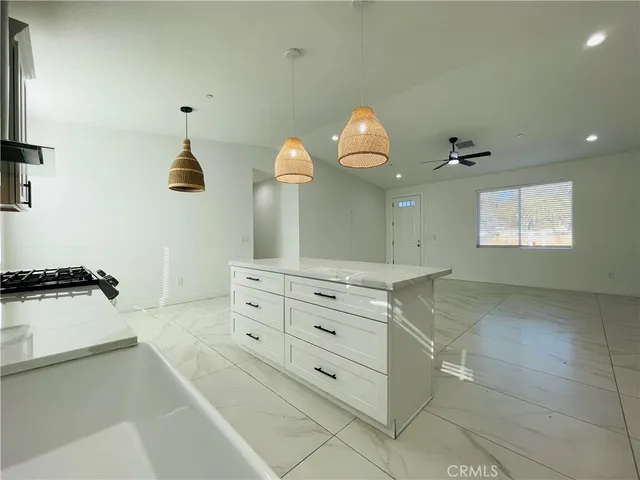 a kitchen with stainless steel appliances a stove and a sink