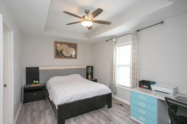 a bedroom with a large bed and a window