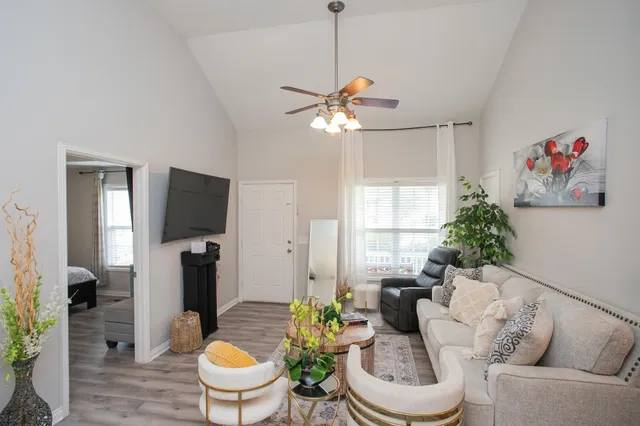 a living room with furniture and a large window