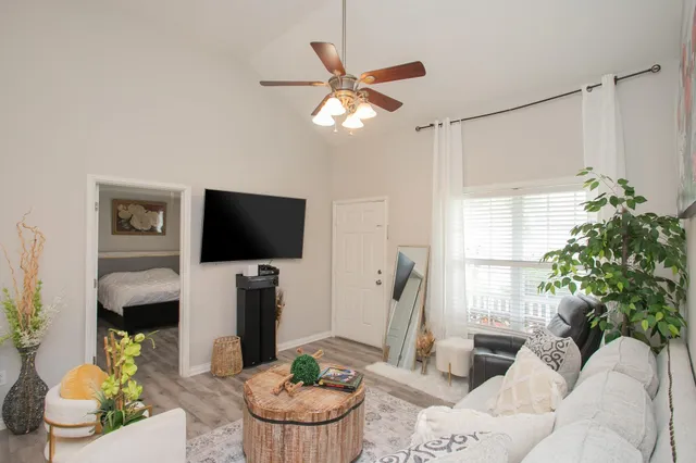 a living room with furniture and a flat screen tv
