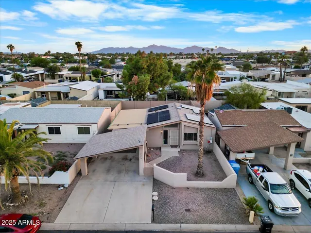an aerial view of a house with a garden