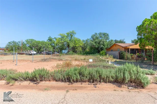 a view of lake with a yard