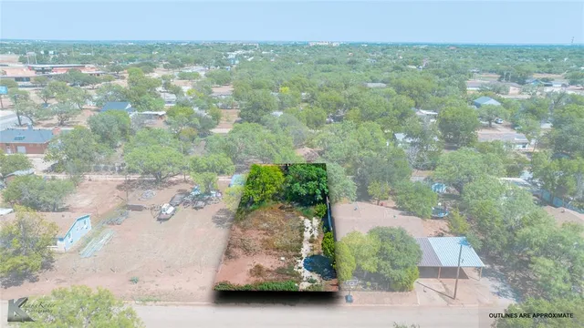 an aerial view of a houses with yard