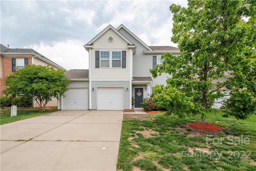 2219 Durand Road Fort Mill, SC 29715 - Photo 1 of 39 a front view of a house with a yard and trees