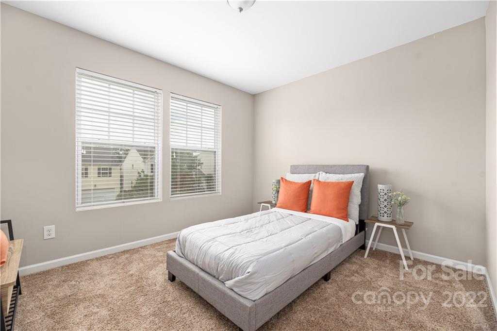 2219 Durand Road Fort Mill, SC 29715 - Photo 26 of 39 a bedroom with a bed lamp and a window