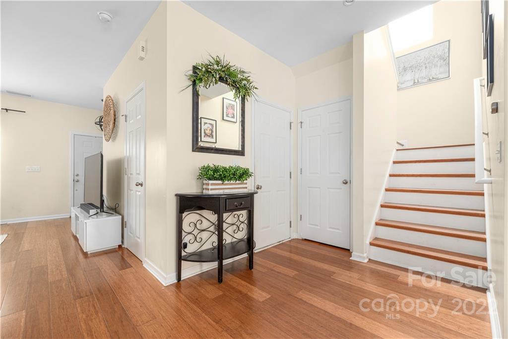 2219 Durand Road Fort Mill, SC 29715 - Photo 3 of 39 a view of a hallway with wooden floor and a potted plant