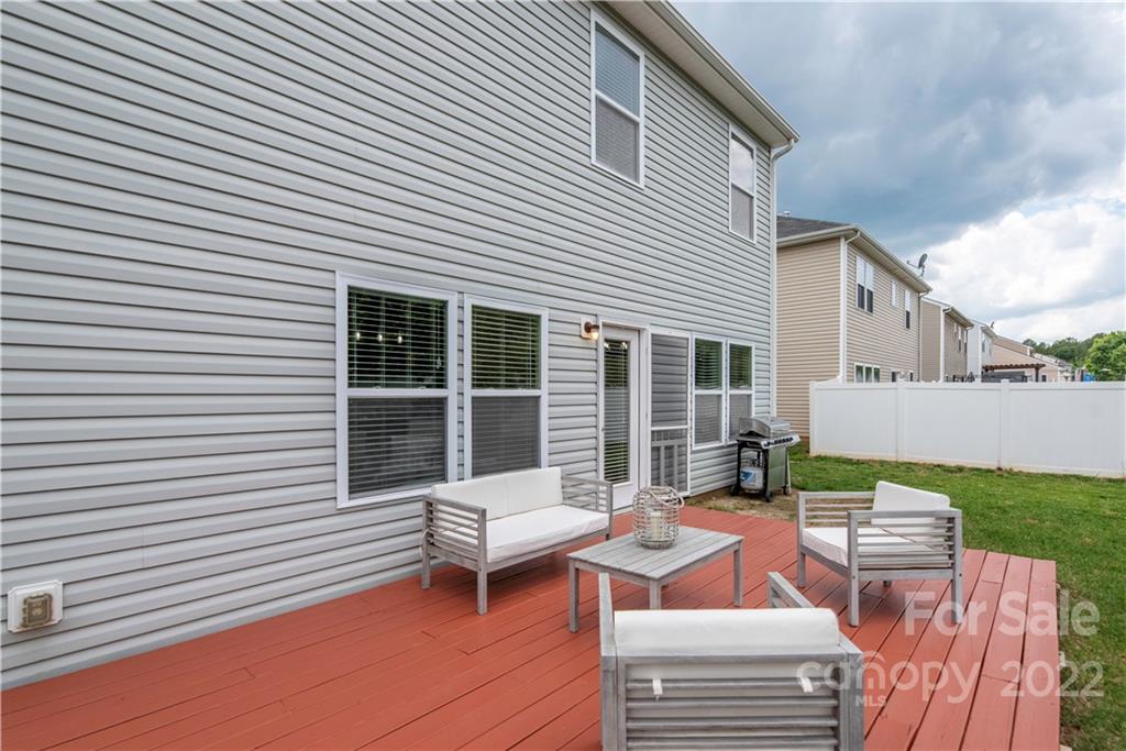 2219 Durand Road Fort Mill, SC 29715 - Photo 39 of 39 a view of a patio with a table and chairs and a barbeque