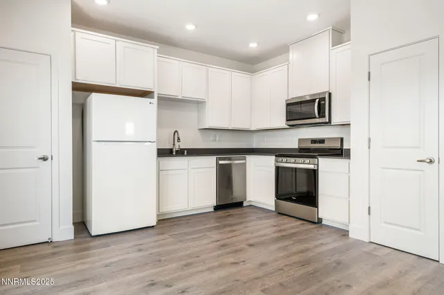 a bedroom with a bed couch and window