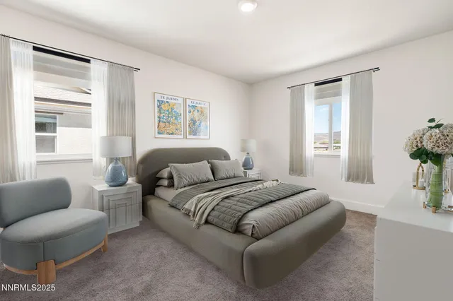 a spacious bedroom with a bed and furniture