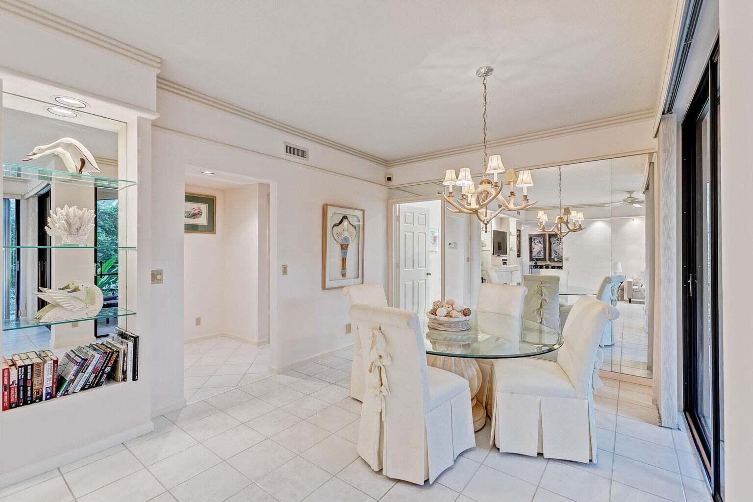16151 West Bay Drive, Unit 161 Jupiter, FL 33477 - Photo 14 of 19 a dining room with furniture and window