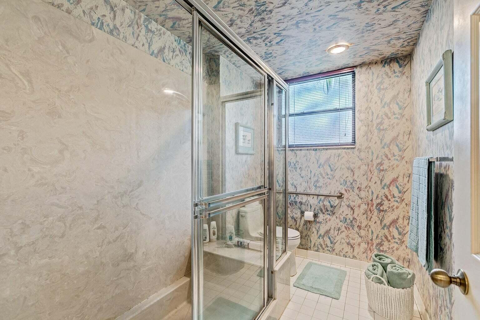 16151 West Bay Drive, Unit 161 Jupiter, FL 33477 - Photo 6 of 19 a bathroom with a shower
