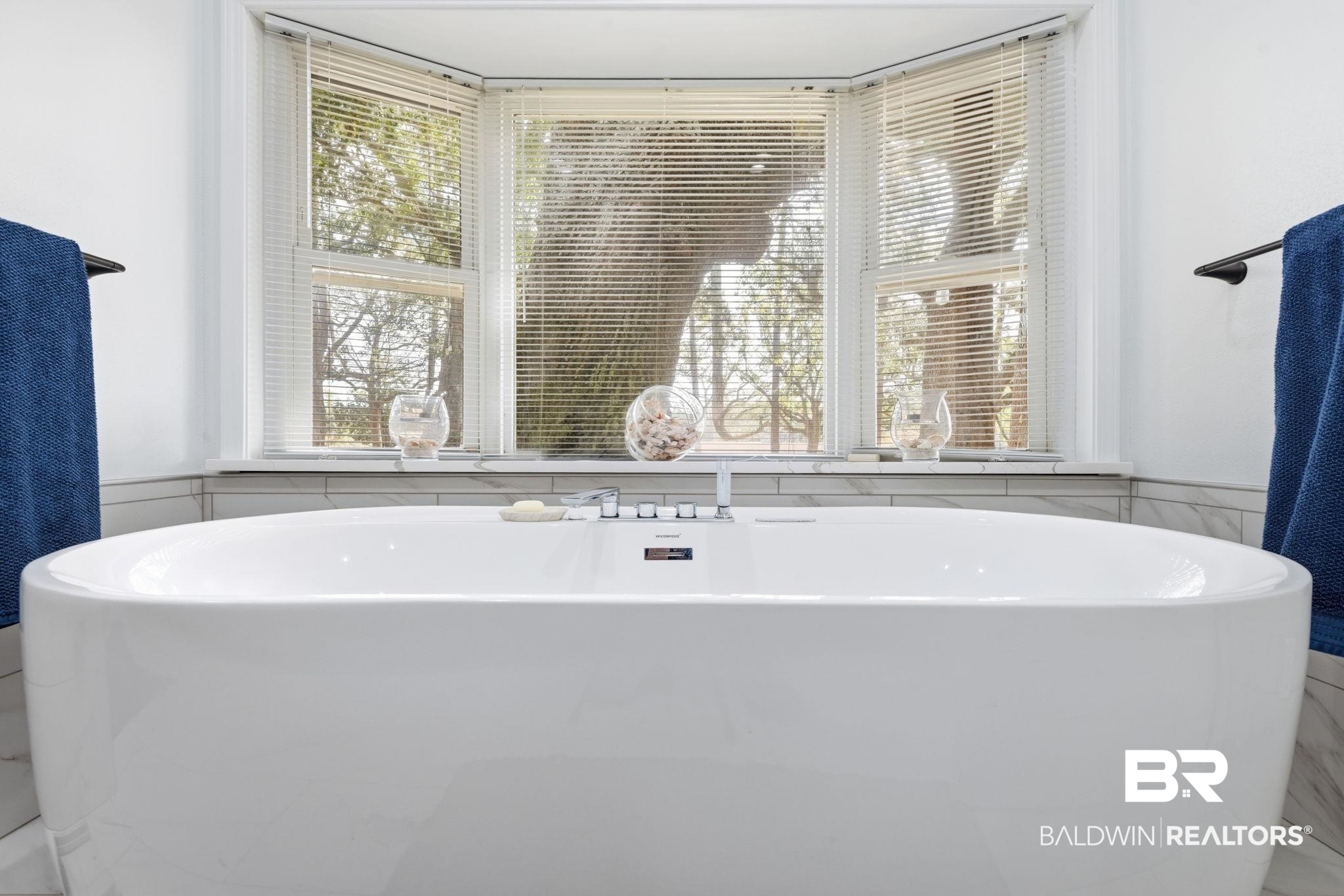 15025 Bellingrath Road Coden, AL 36523 - Photo 60 of 79 Full bathroom featuring wainscoting, a freestanding tub, and tile walls