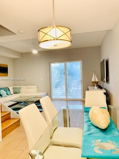 619 Meridian Avenue, Unit 4 Miami Beach, FL 33139 - Photo 11 of 30 a living room with couches and pool table