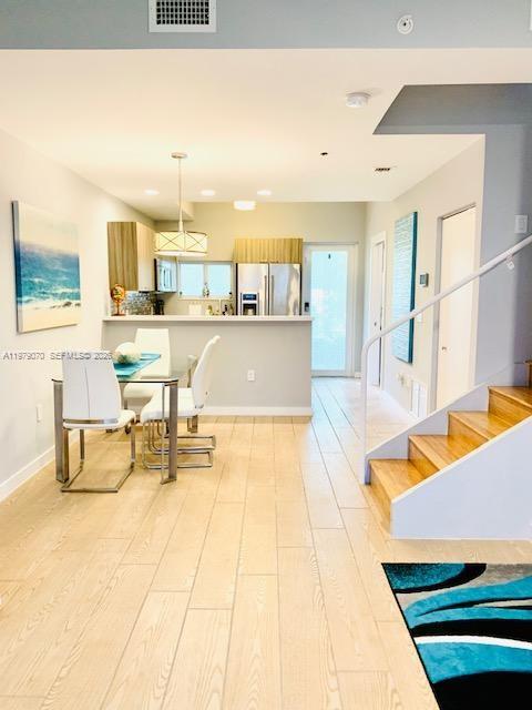 619 Meridian Avenue, Unit 4 Miami Beach, FL 33139 - Photo 15 of 30 a living room with stainless steel appliances furniture and a kitchen view