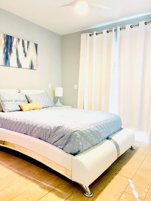 619 Meridian Avenue, Unit 4 Miami Beach, FL 33139 - Photo 22 of 30 a bedroom with a bed and walk in closet