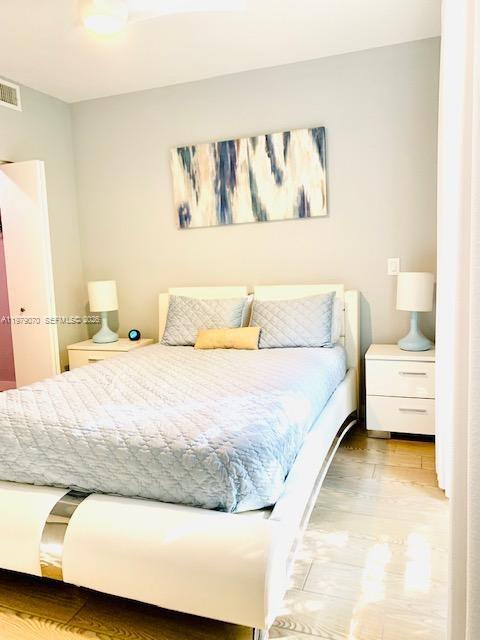 619 Meridian Avenue, Unit 4 Miami Beach, FL 33139 - Photo 23 of 30 a bedroom with a bed and a couch